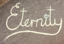 Eternity written in Chalk on the footpath 